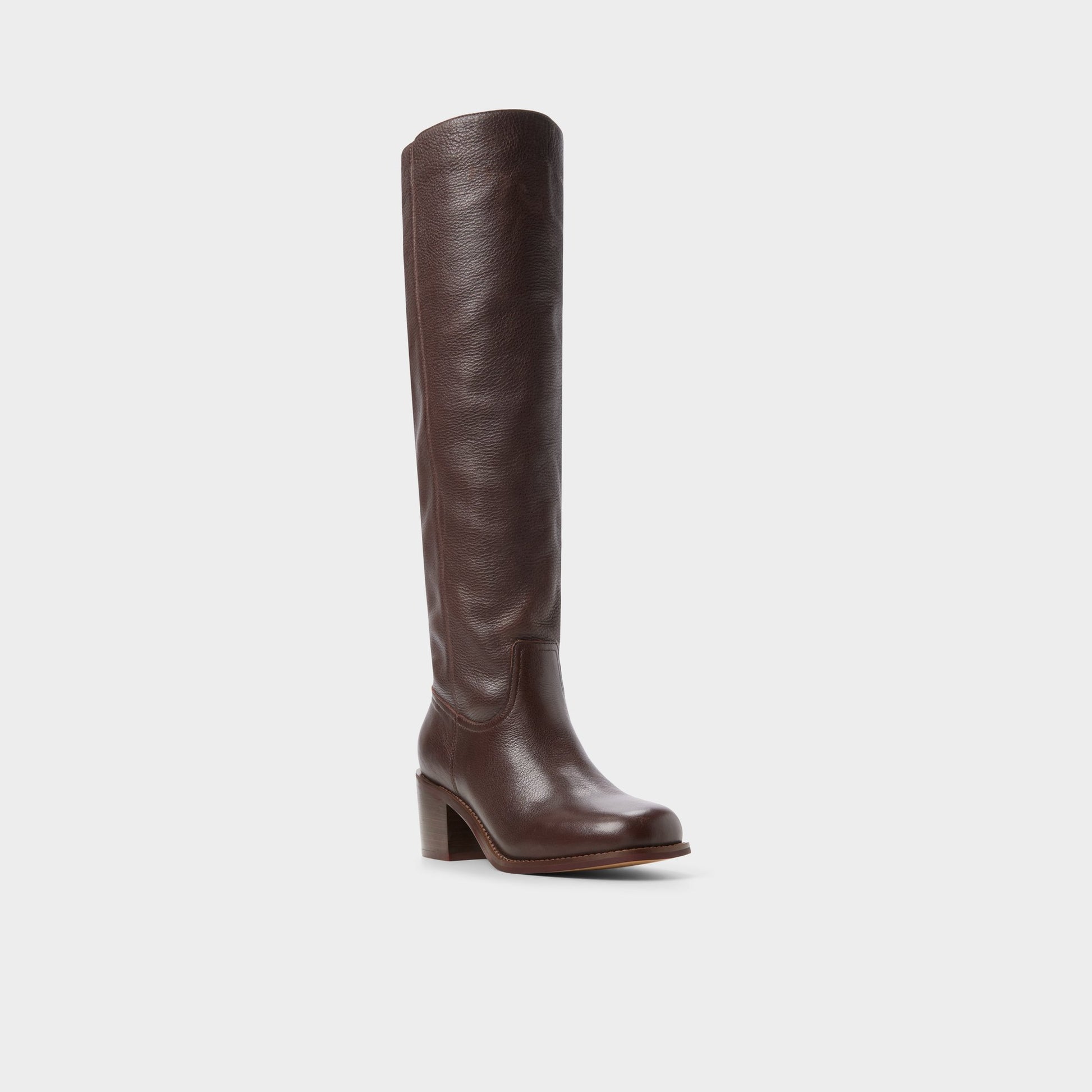 Three-quarter angle of Dark brown Haverton Block heel knee-high boot's front side