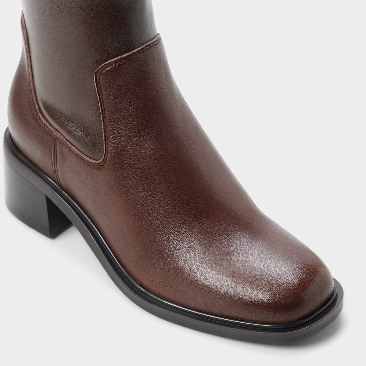 Three-quarter angle of Dark brown Tywyn Block heel ankle boot's front side