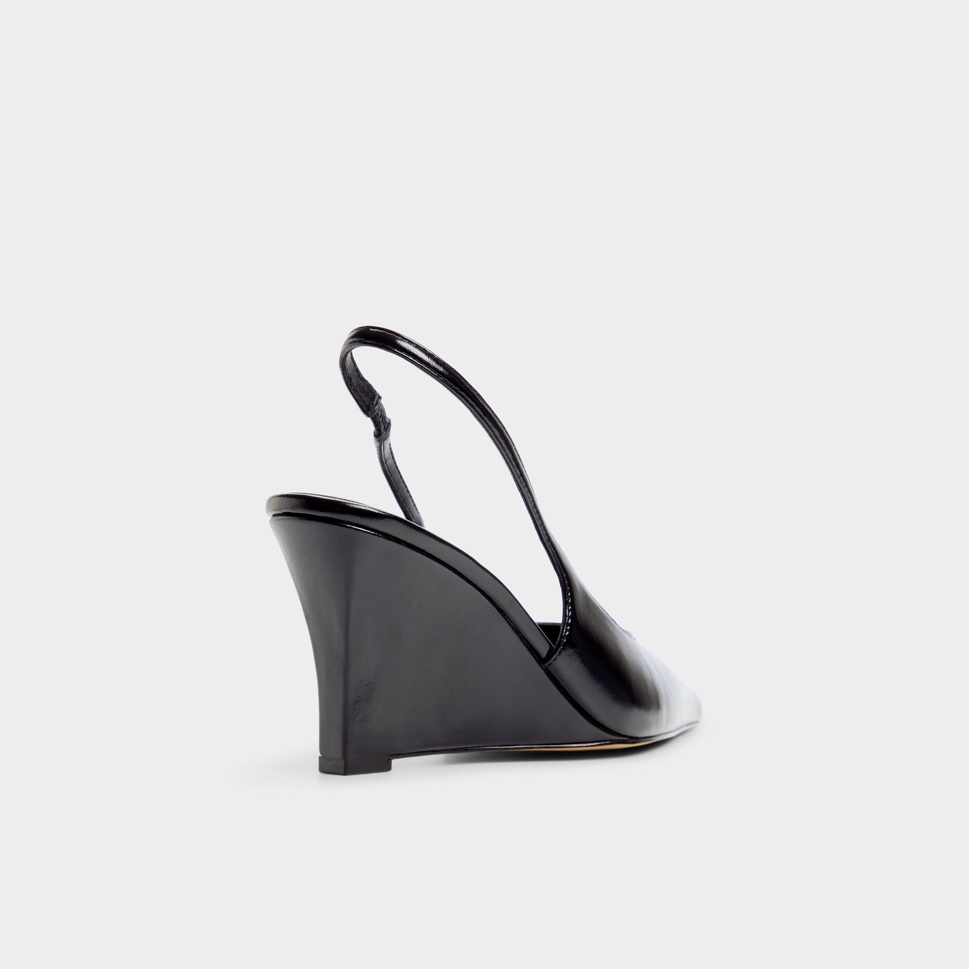 Three-quarter angle of Black Jenadine Slingback wedge's back side