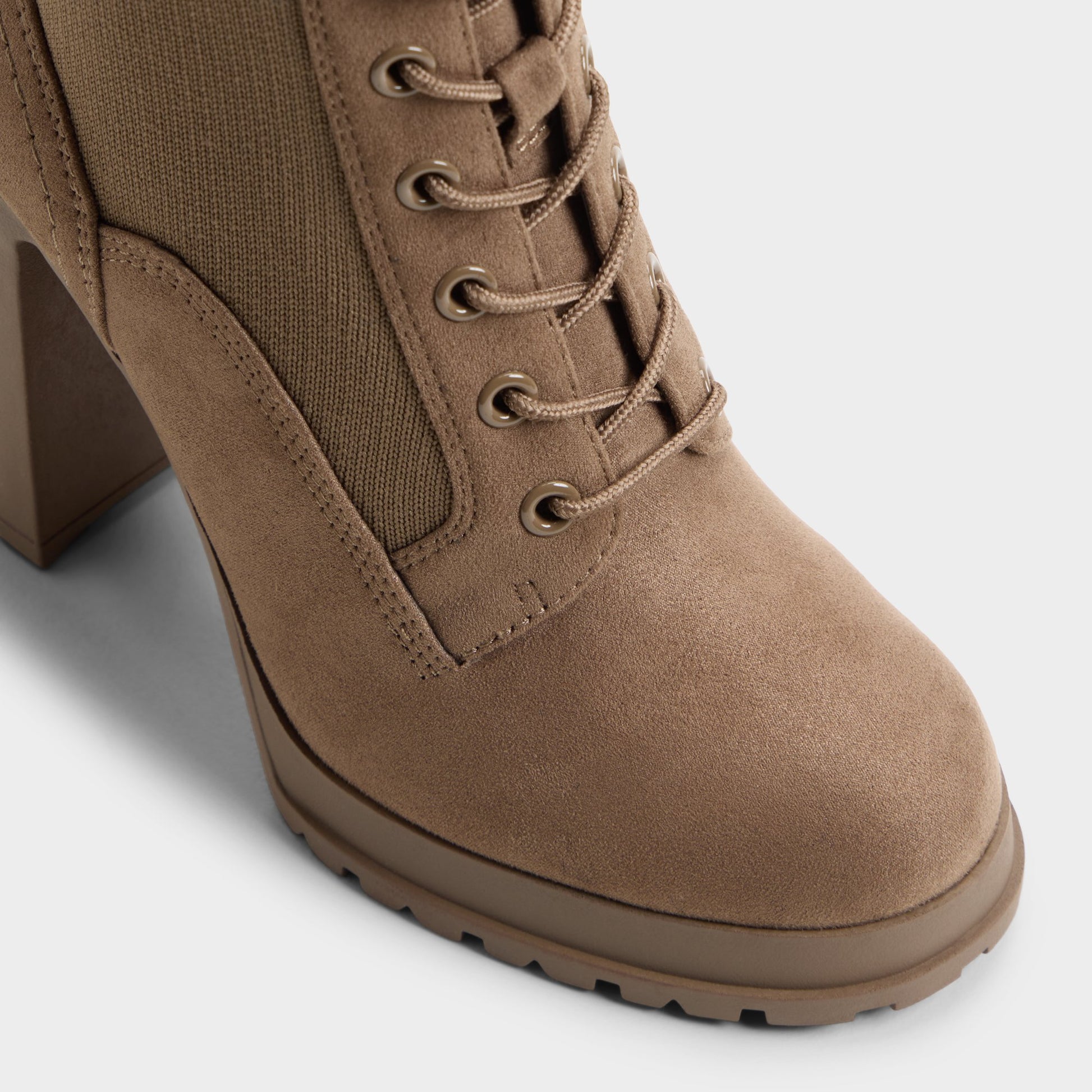Three-quarter angle of Khaki Rebellious Lug sole combat boot's front side