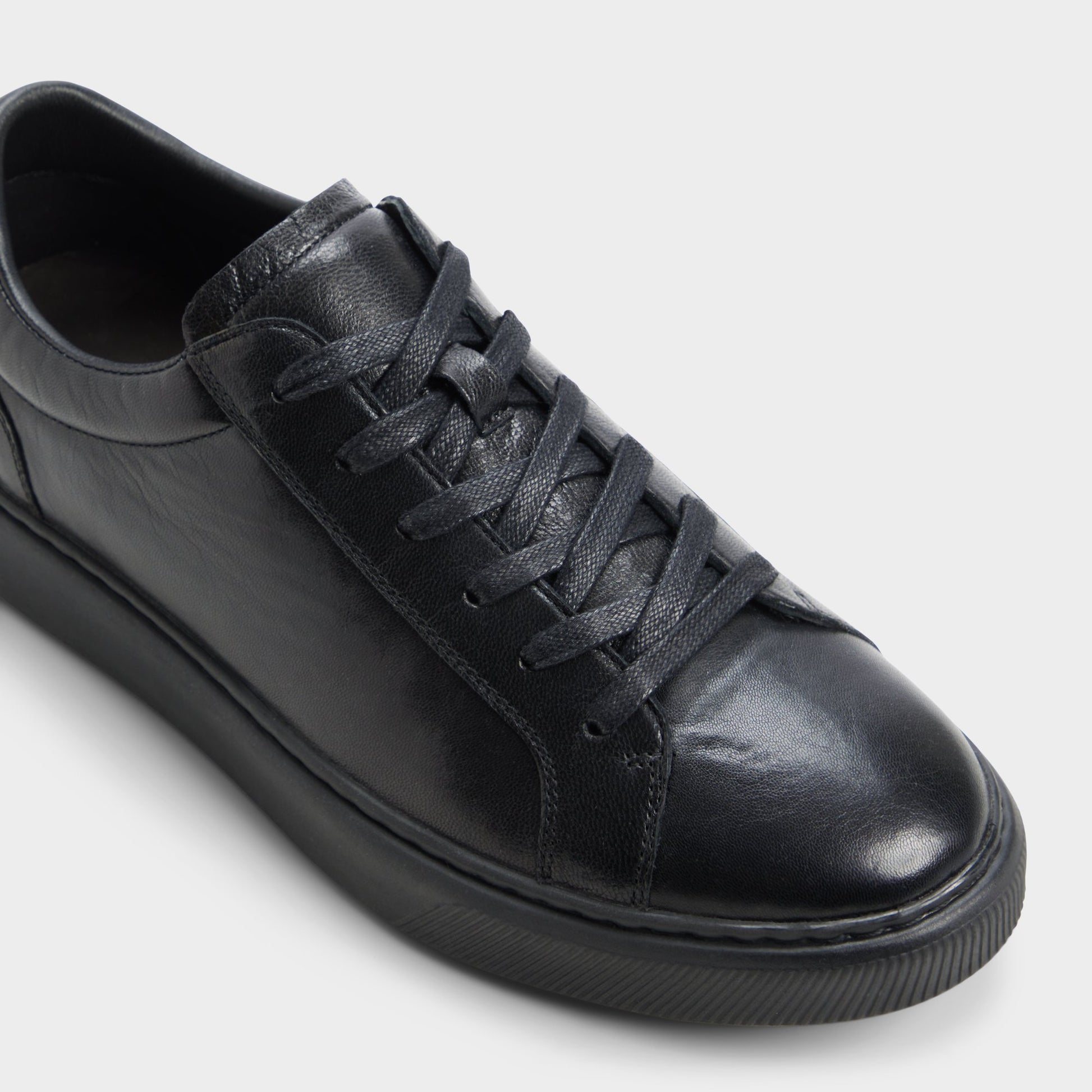 Three-quarter angle of Black Garett Low top sneaker's front side