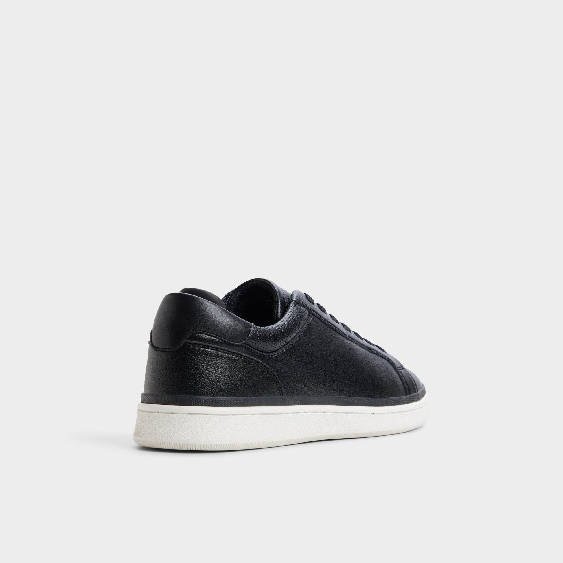 Three-quarter angle of Black Petey Slip-on's back side