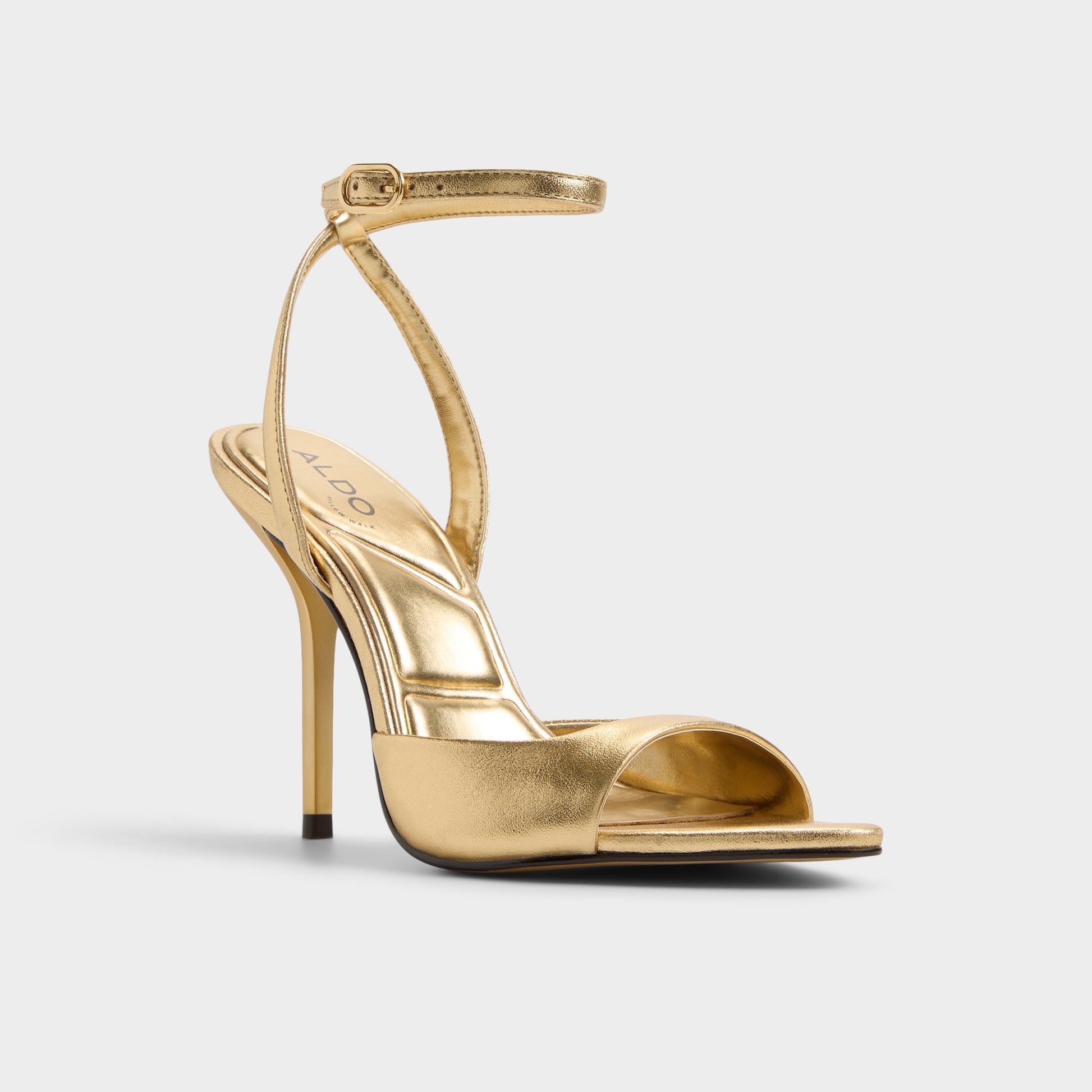 Three-quarter angle of Gold Forevermore Strappy heeled sandal's front side