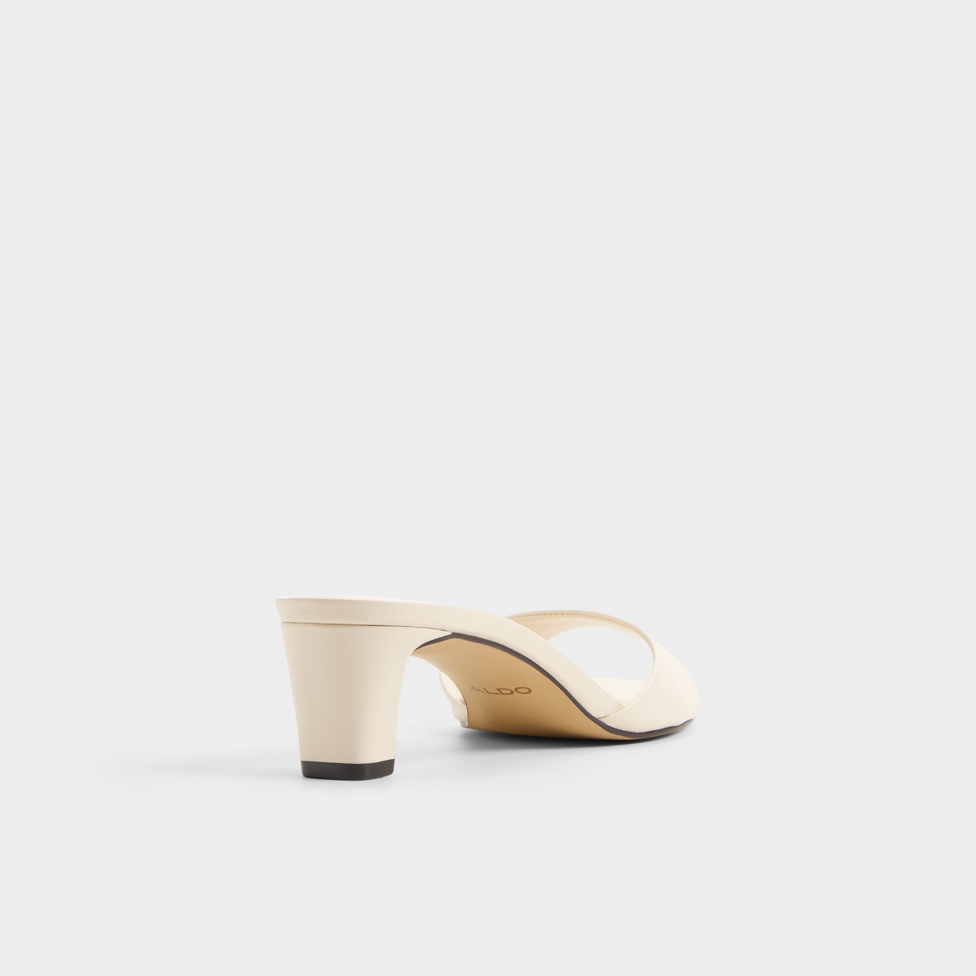 Three-quarter angle of White Ankea Heeled mule's back side