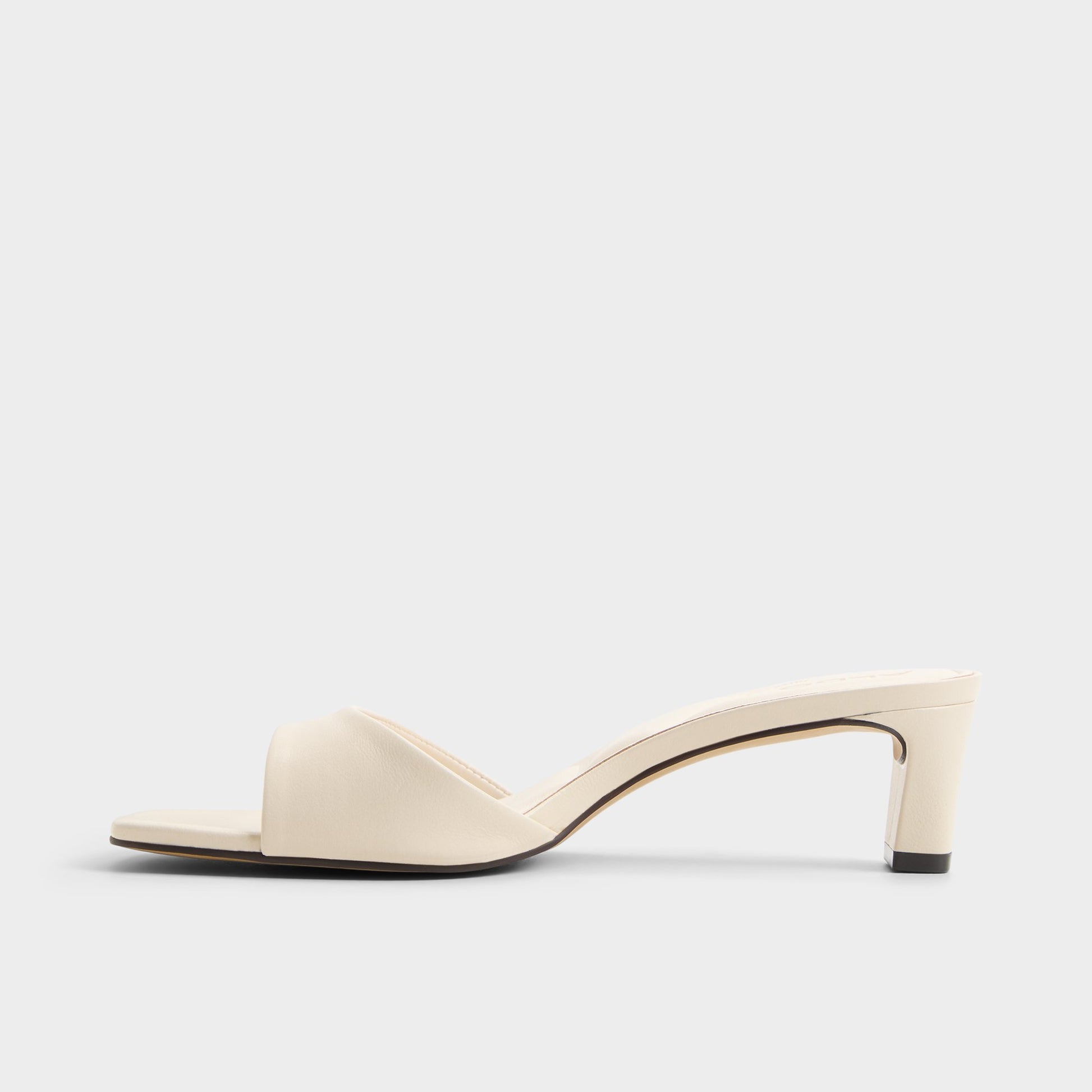 Side view of White Ankea Heeled mule