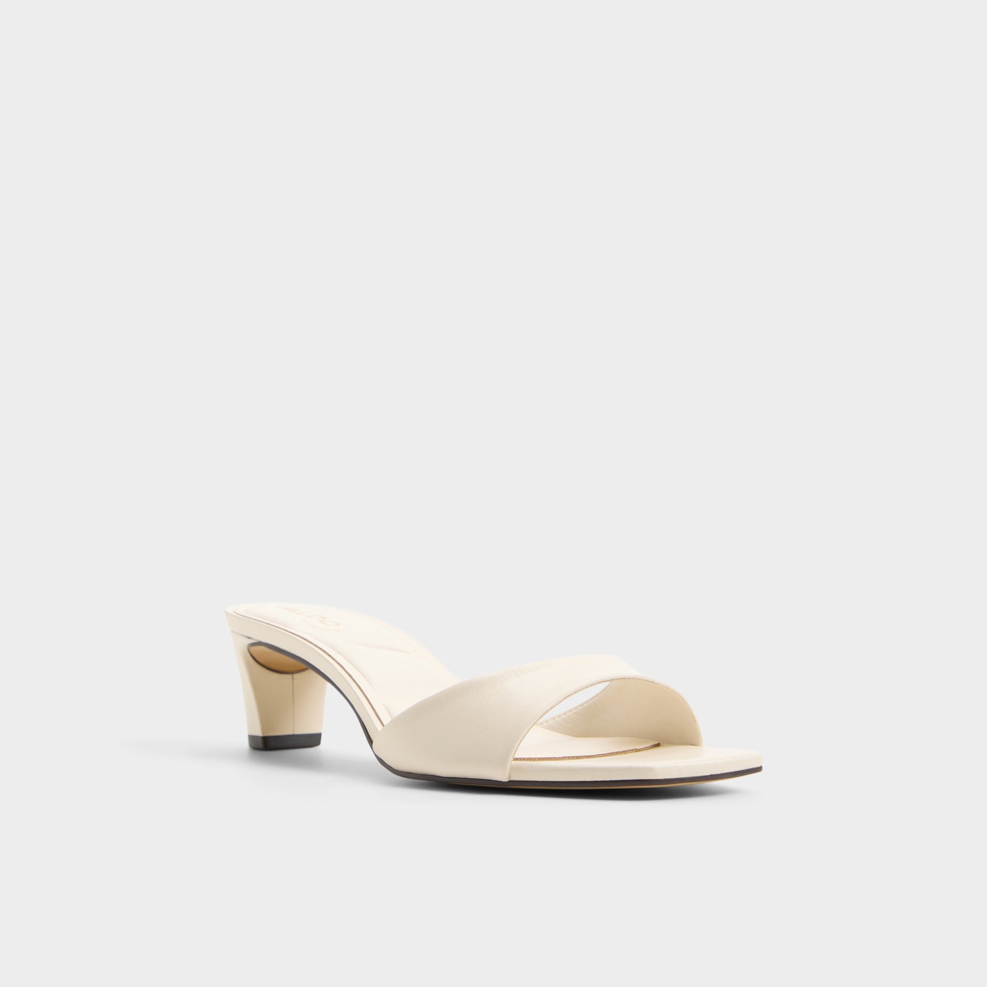 Three-quarter angle of White Ankea Heeled mule's front side