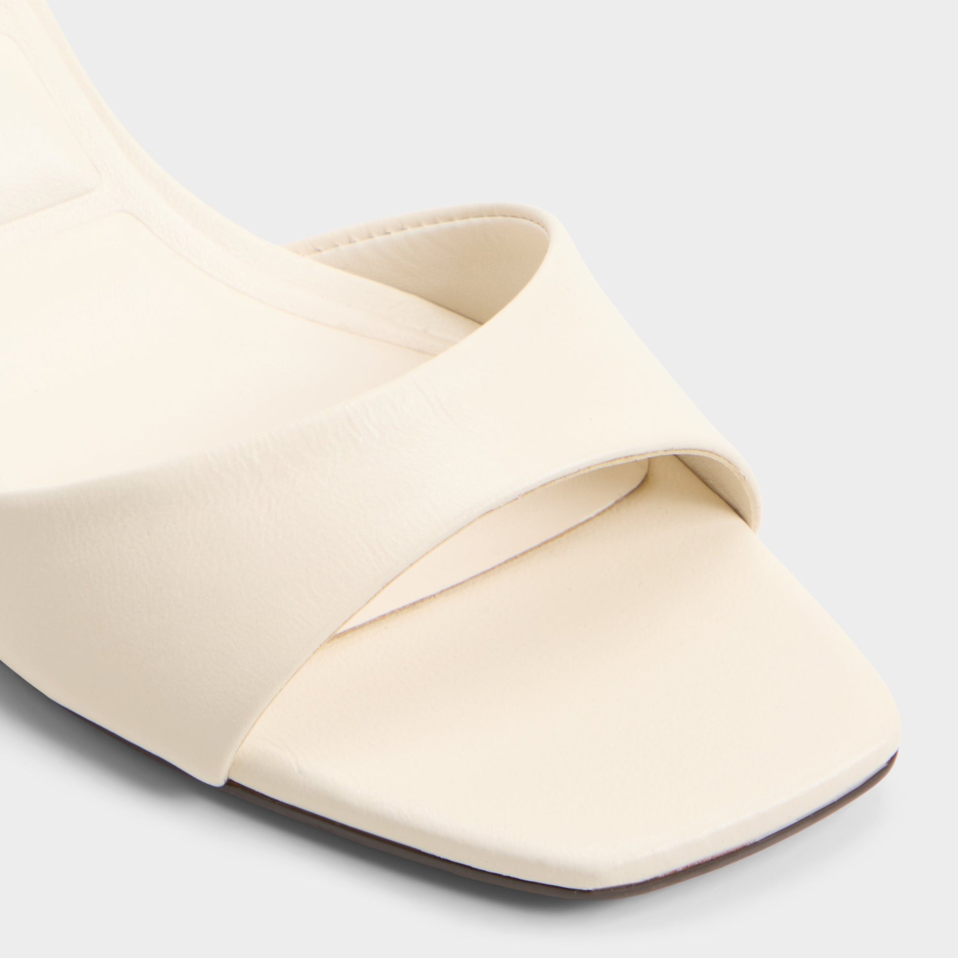 Close-up of the White Ankea Heeled mule