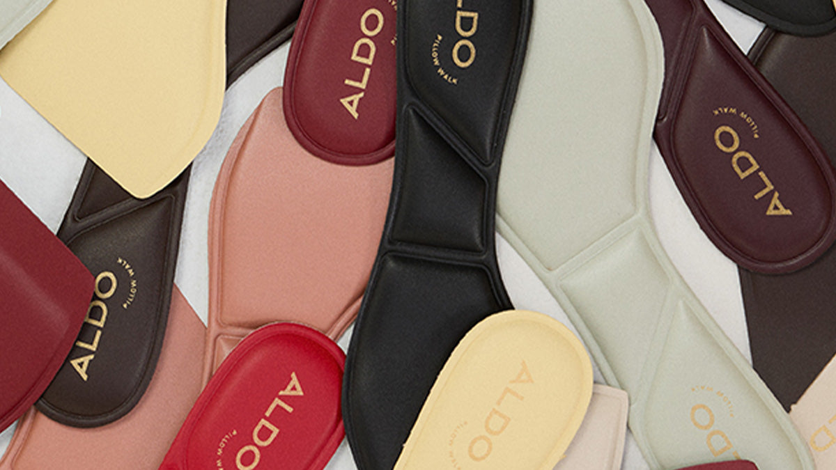 Collection of ALDO branded shoe cushioned soles on a white background.