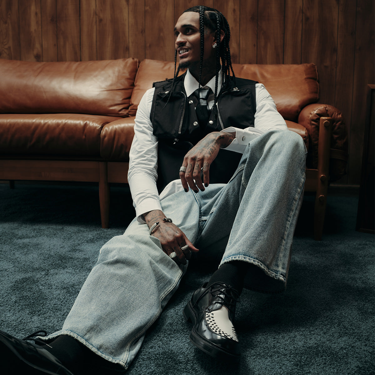 Jordan Clarkson wearing men's black and white Buckley oxfords