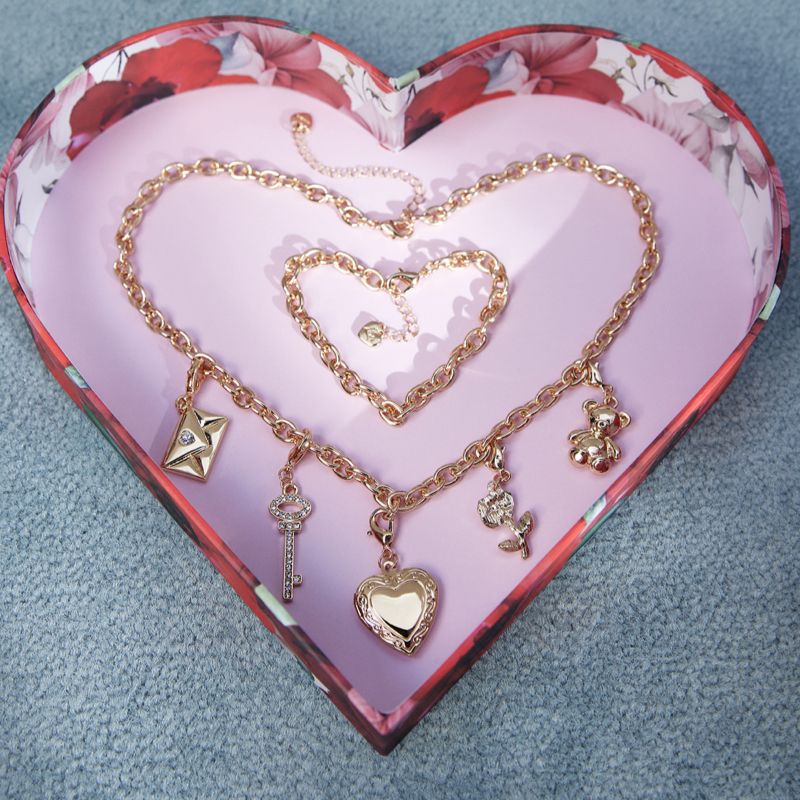 Women's gold Bemyvalentine jewelry set.